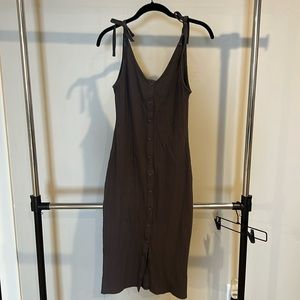 Grey ribbed, fitted dress with tie straps and button details. Size M. Worn once